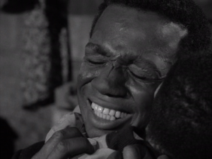 Ivan Dixon as Bolie Jackson hugging Steven Perry as Henry Temple from the Twilight Zone episode "The Big Tall Wish"