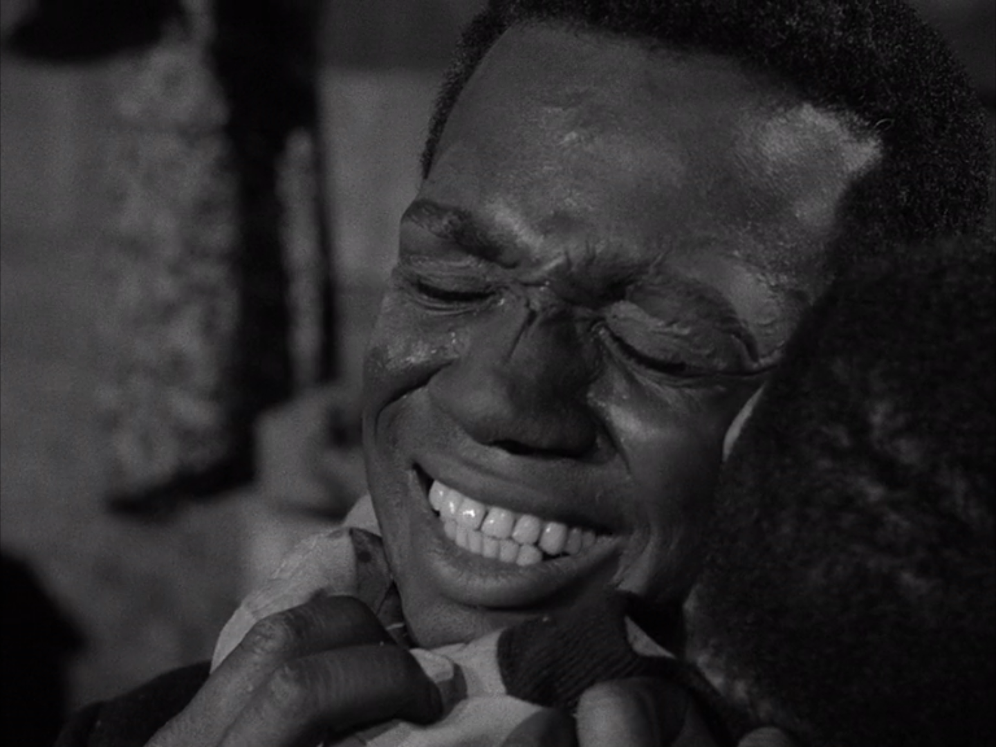 Ivan Dixon as Bolie Jackson hugging Steven Perry as Henry Temple from the Twilight Zone episode "The Big Tall Wish"